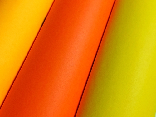 Multicolor,Rolled,Paper,Background,With,Copy,Space,For,Commercial,Text